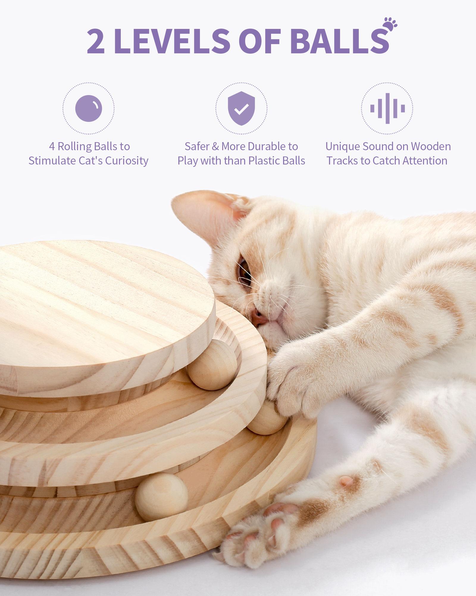 8a7cc92d-e68b-41be-bb17-b3c64734870e Cat playing with a two-level wooden ball track