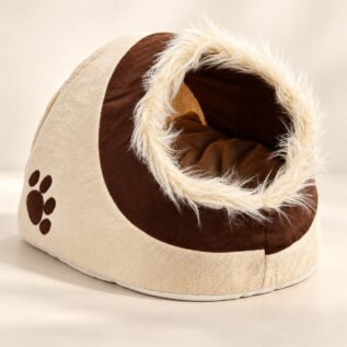 Cream and brown cave pet bed with plush entrance on a light background