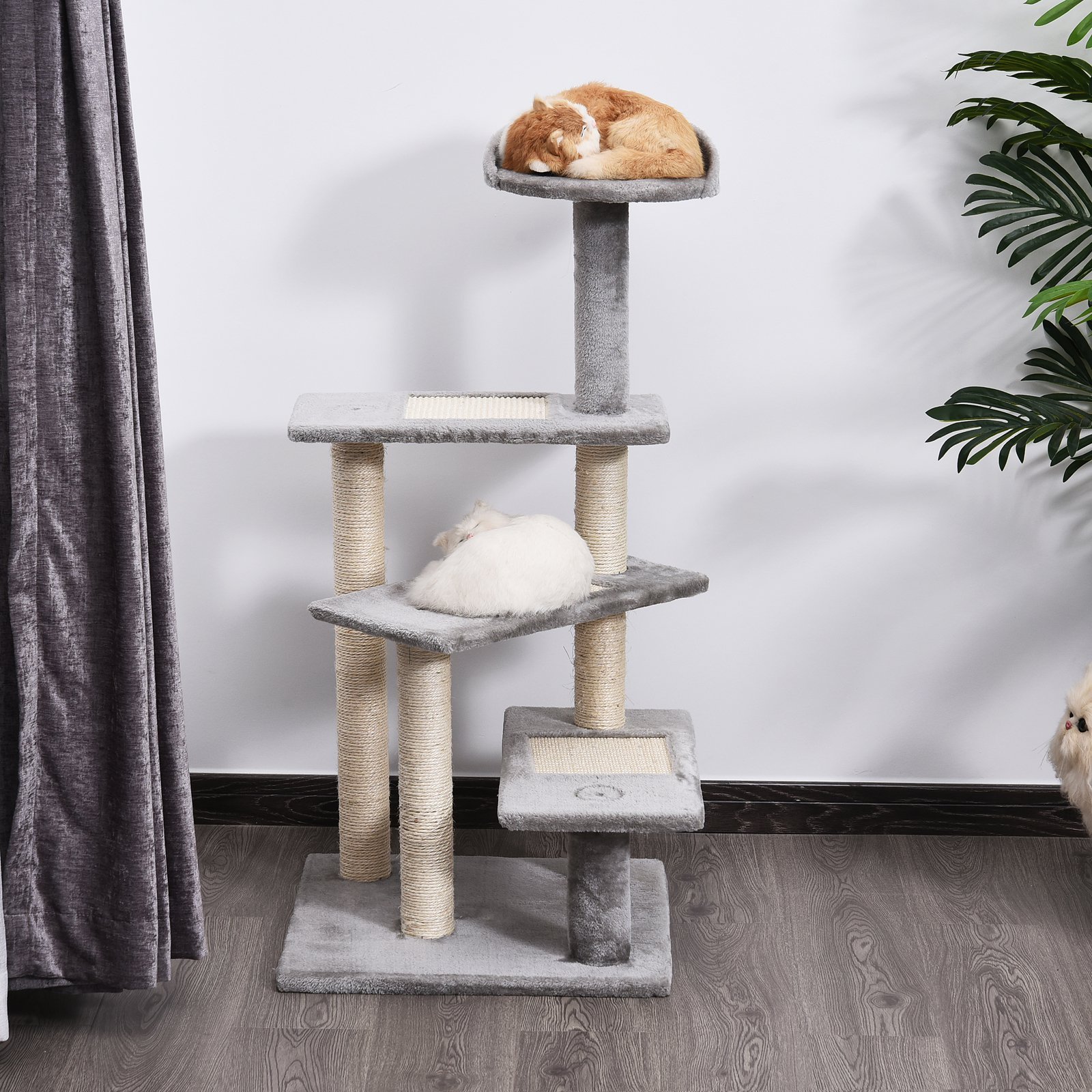 e774fa41-ed7d-48de-a820-393959d00cf0.jpg Cats resting on a gray multi-level cat tree